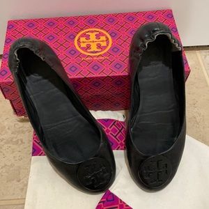 Black Tory Burch flats.